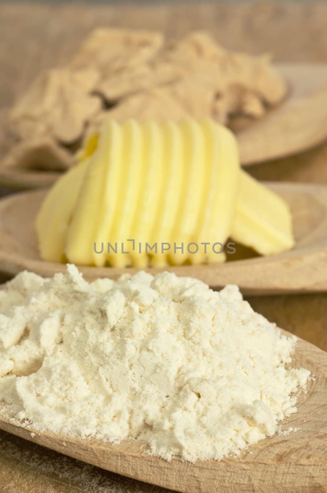 baking ingredients butter, yeast and meal