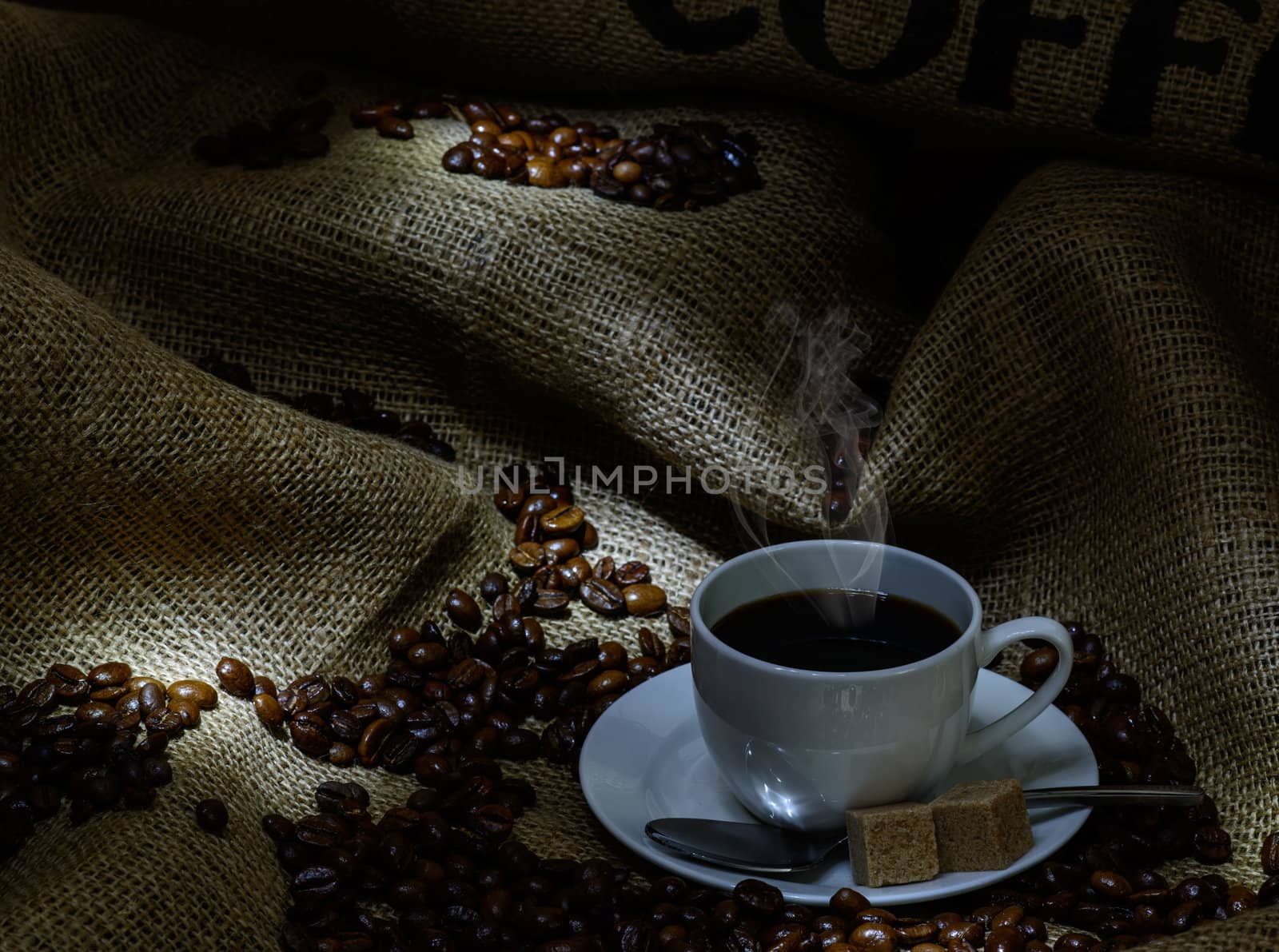 Coffee cup, beans and burlap. still life