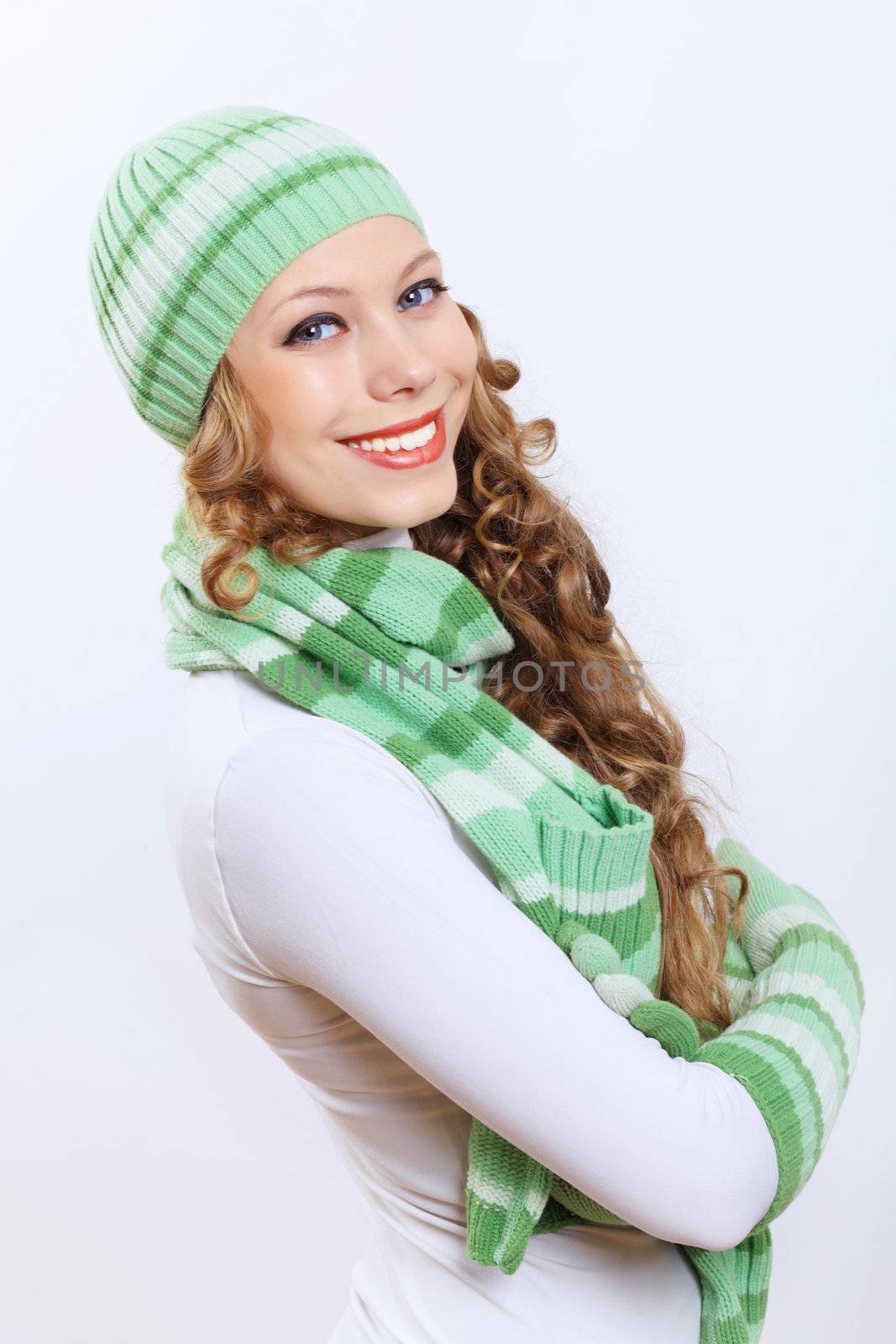 Young pretty woman in warm winter hat and scarf