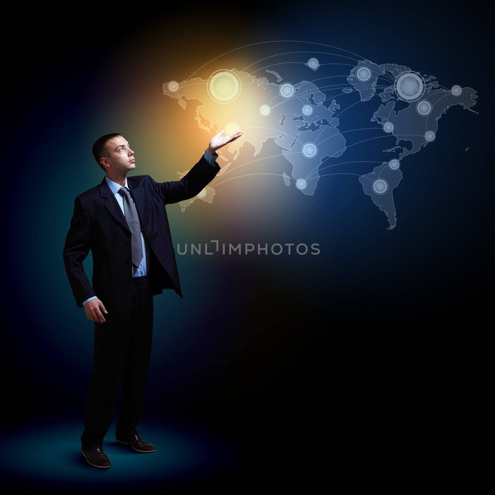Businessman standing with modern technology symbols next to him