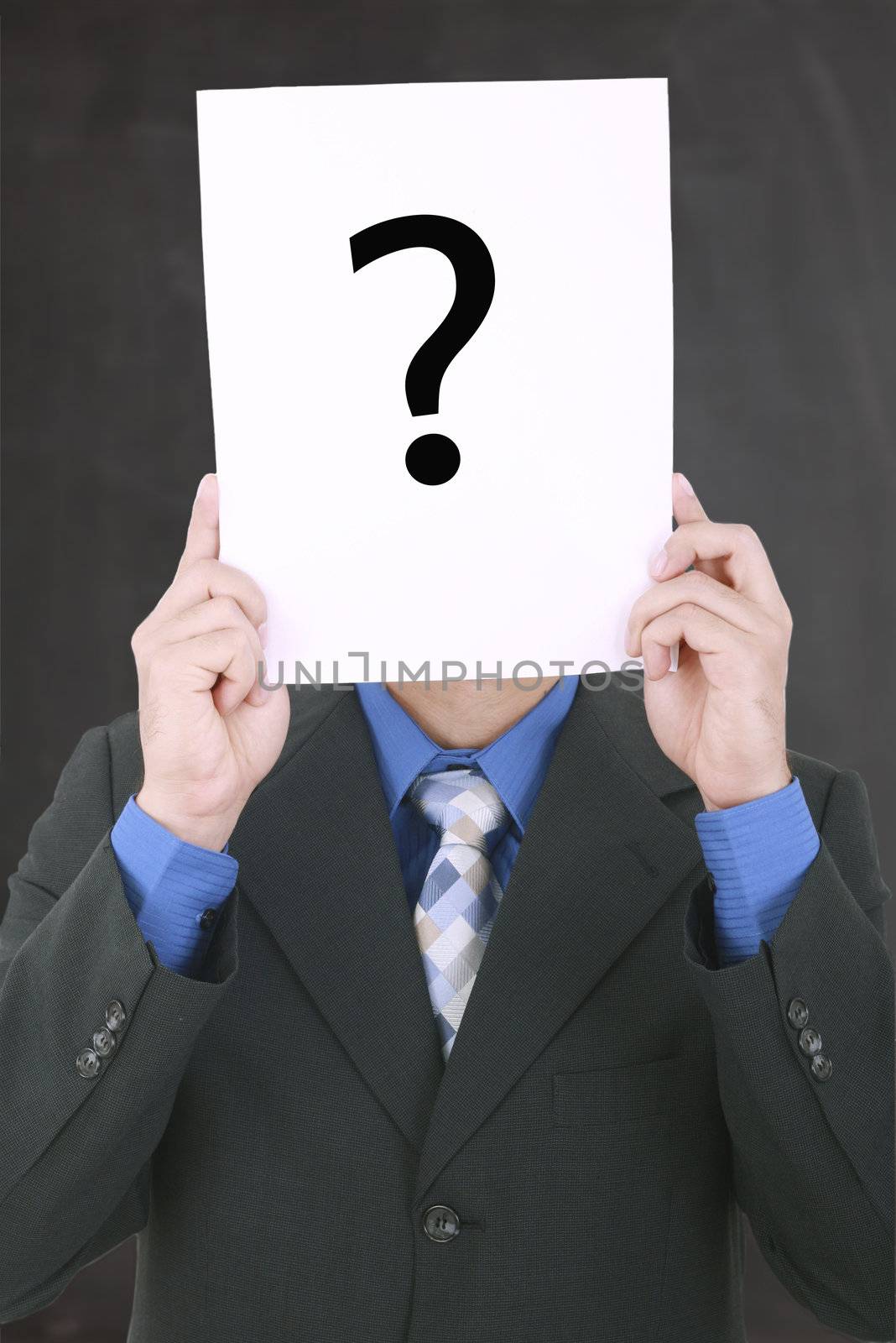 Young businessman holding a white billboard with a question mark by dacasdo