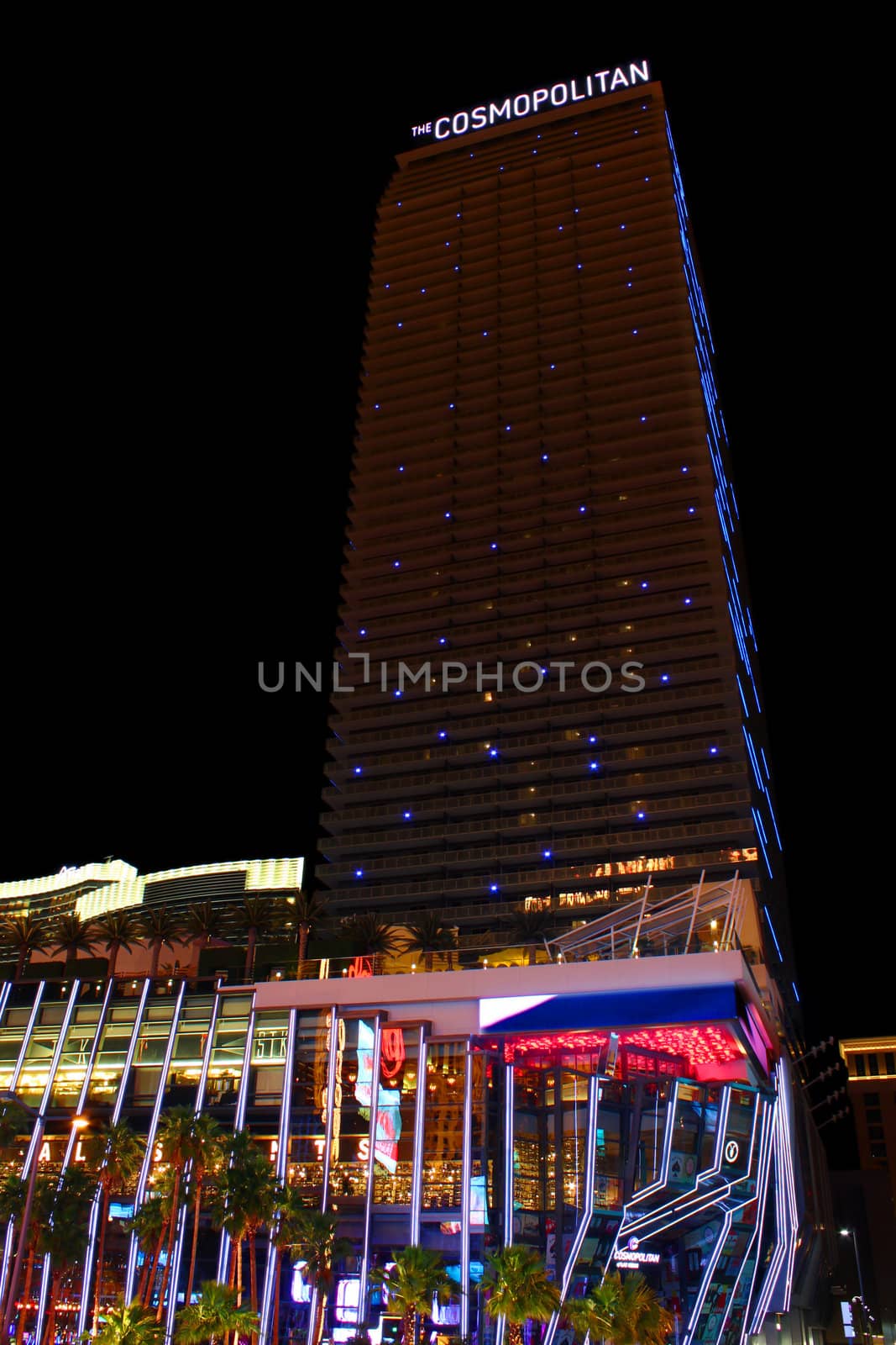 Las Vegas, USA - May 22, 2012: The Cosmopolitan of Las Vegas is a casino and hotel that opened in 2010 on the famous Las Vegas Strip.  Pictured here is the highrise hotel tower with parallel blue lights at night.