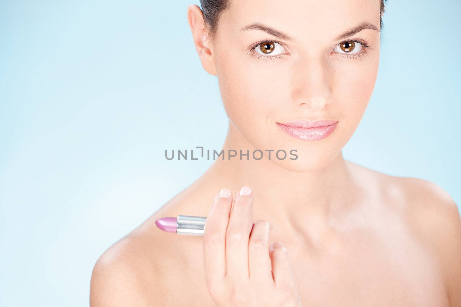woman holding lipstick by imarin