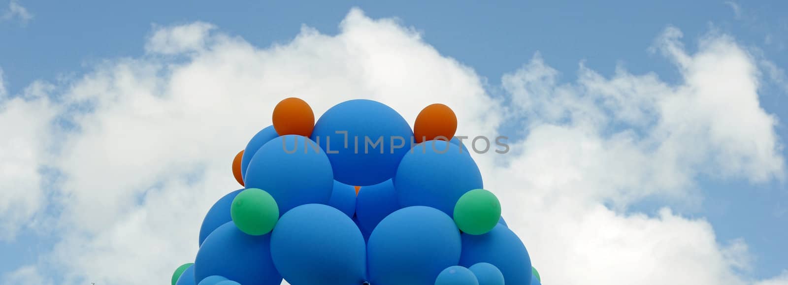 colorful balloons against blue sky by inxti