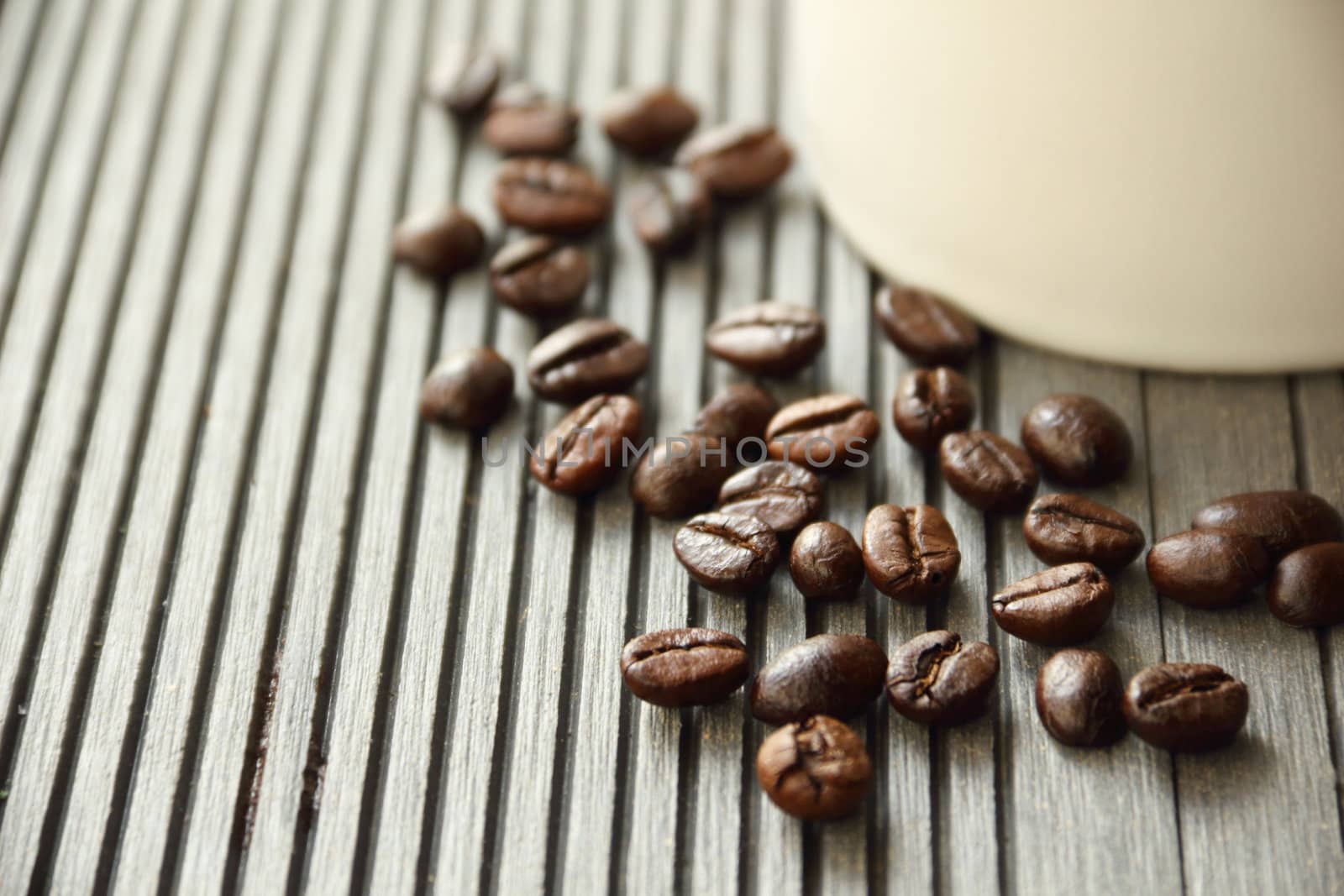 Close up coffee beans on wooden background
