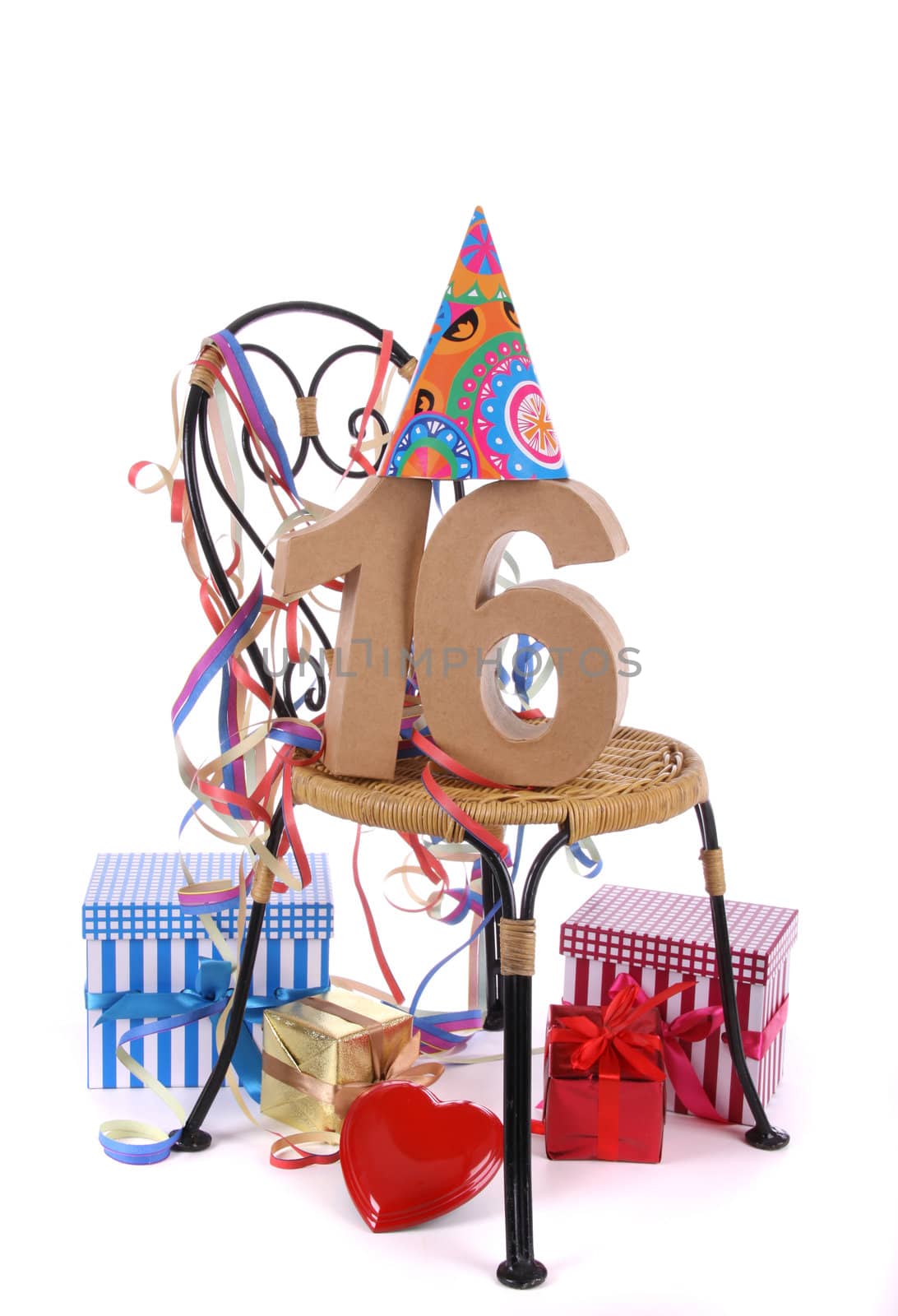 Number of age in a colorful studio setting with paper party hat and figures, a red heart and gifts