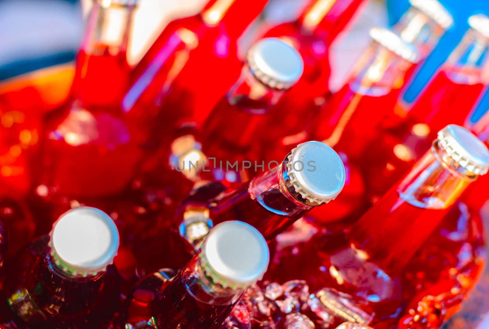 Bottles of fruit juice in ice bucket