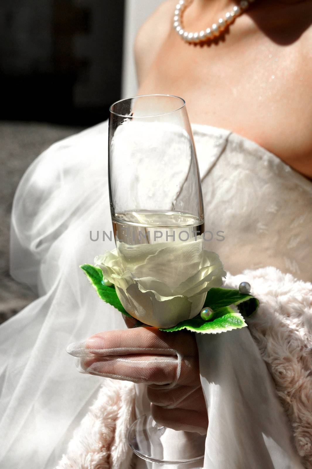 Beautiful bride with a glass of champagne;