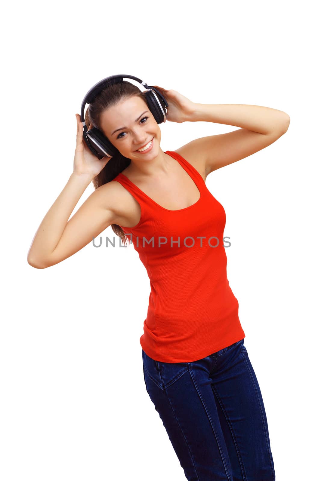 Happy smiling girl dancing and listening to music