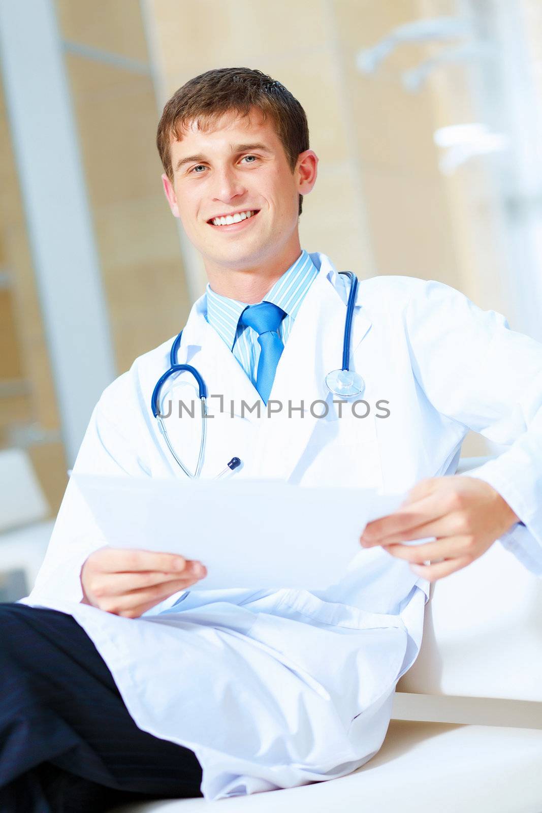 Portrait of friendly male doctor in hospital smiling