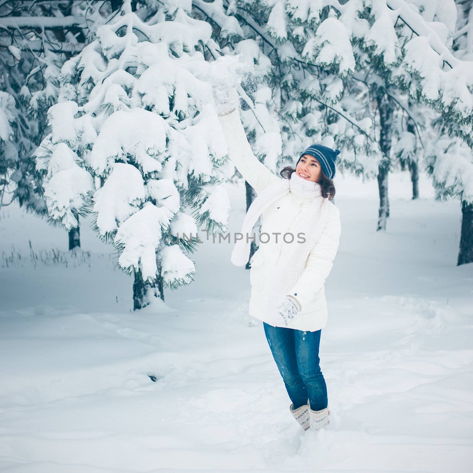 Portrait of beautiful young girl in winter day