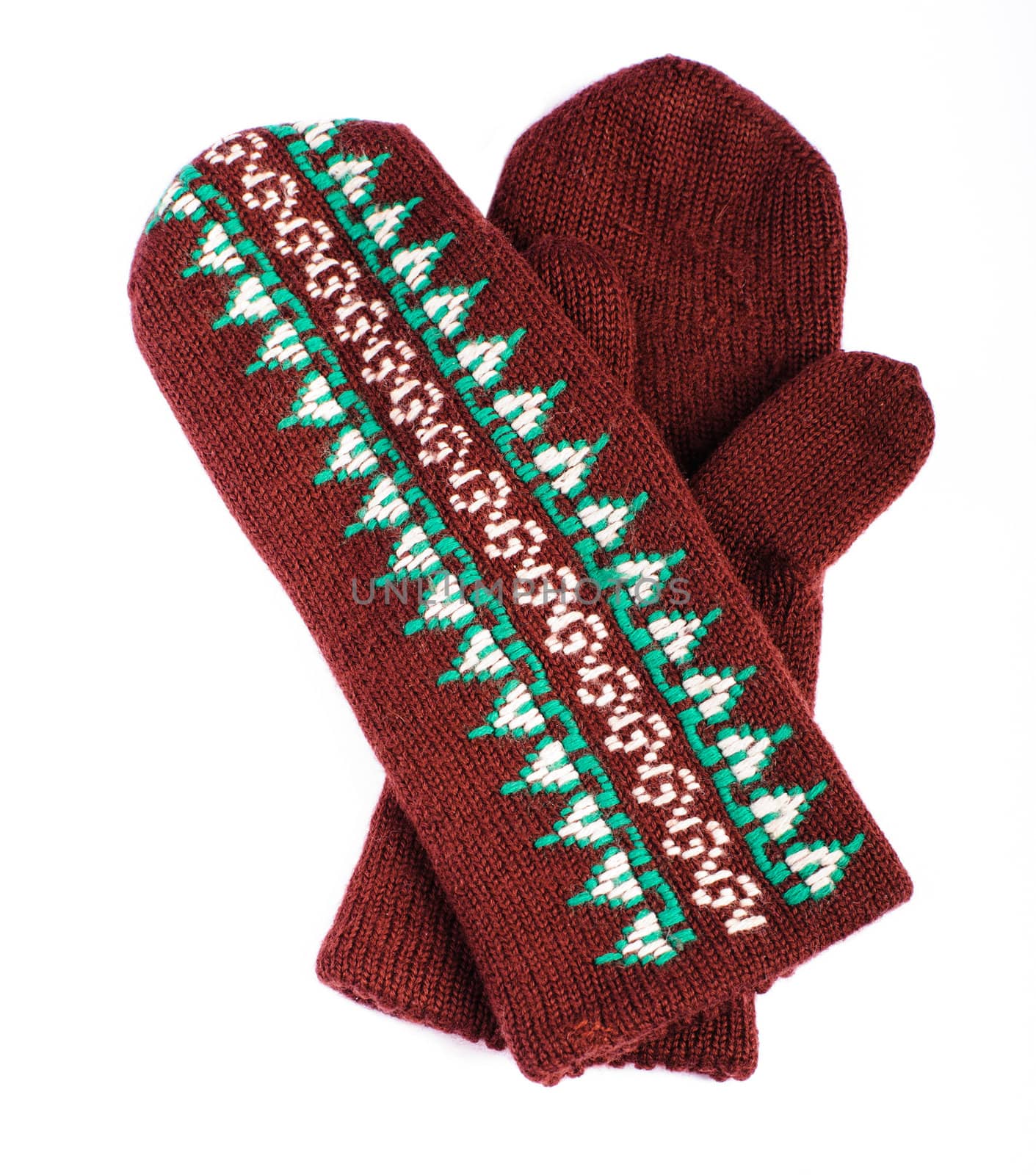 Brown woolen knitted mittens on white background