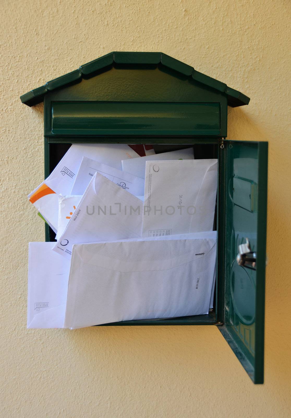 street mailbox completely filled with letters
