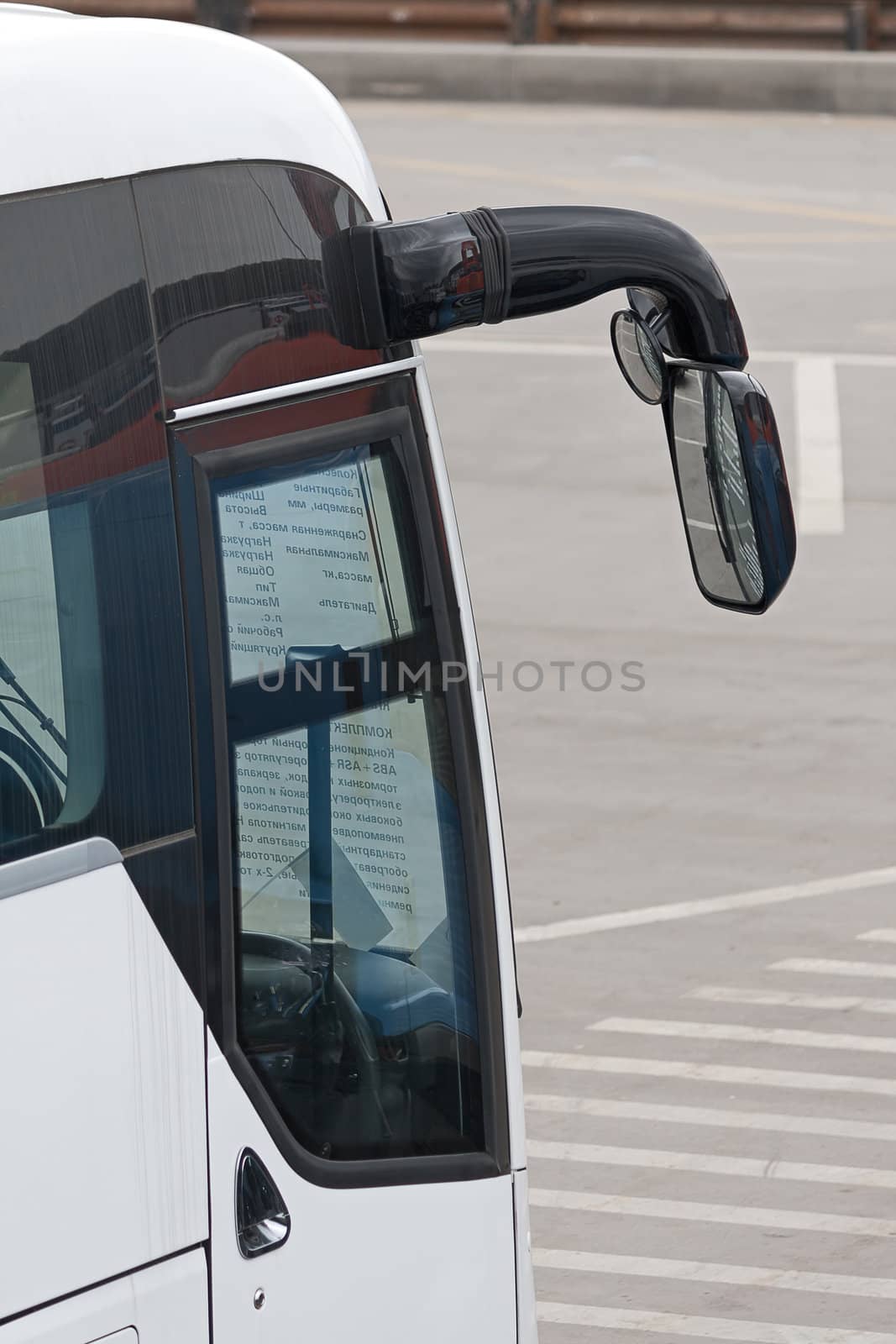 Mirror bus close-up. Bus stands parked.