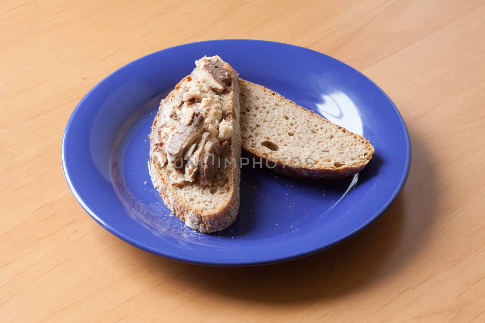 Sardines on bread on a plate ready to eat