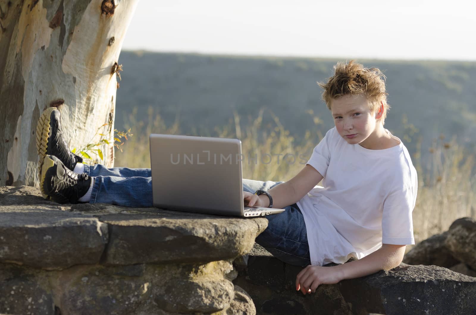 Serious teen rest with notebook on nature