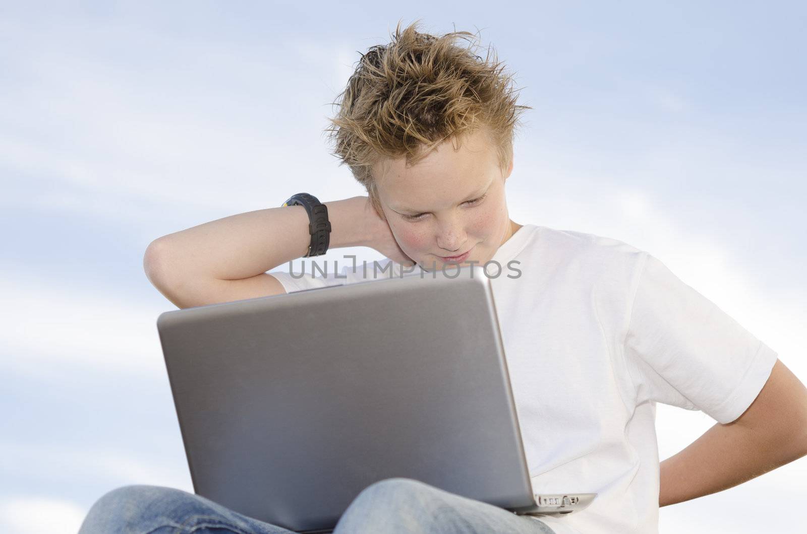 Fair-haired pretty guy rest with laptop in nature