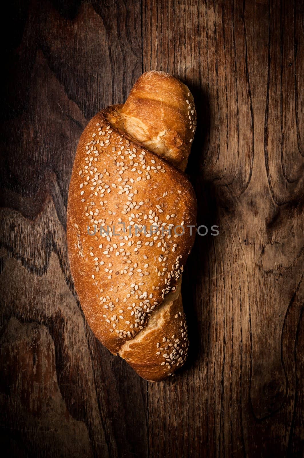 wholemeal sesame bread on brown wood