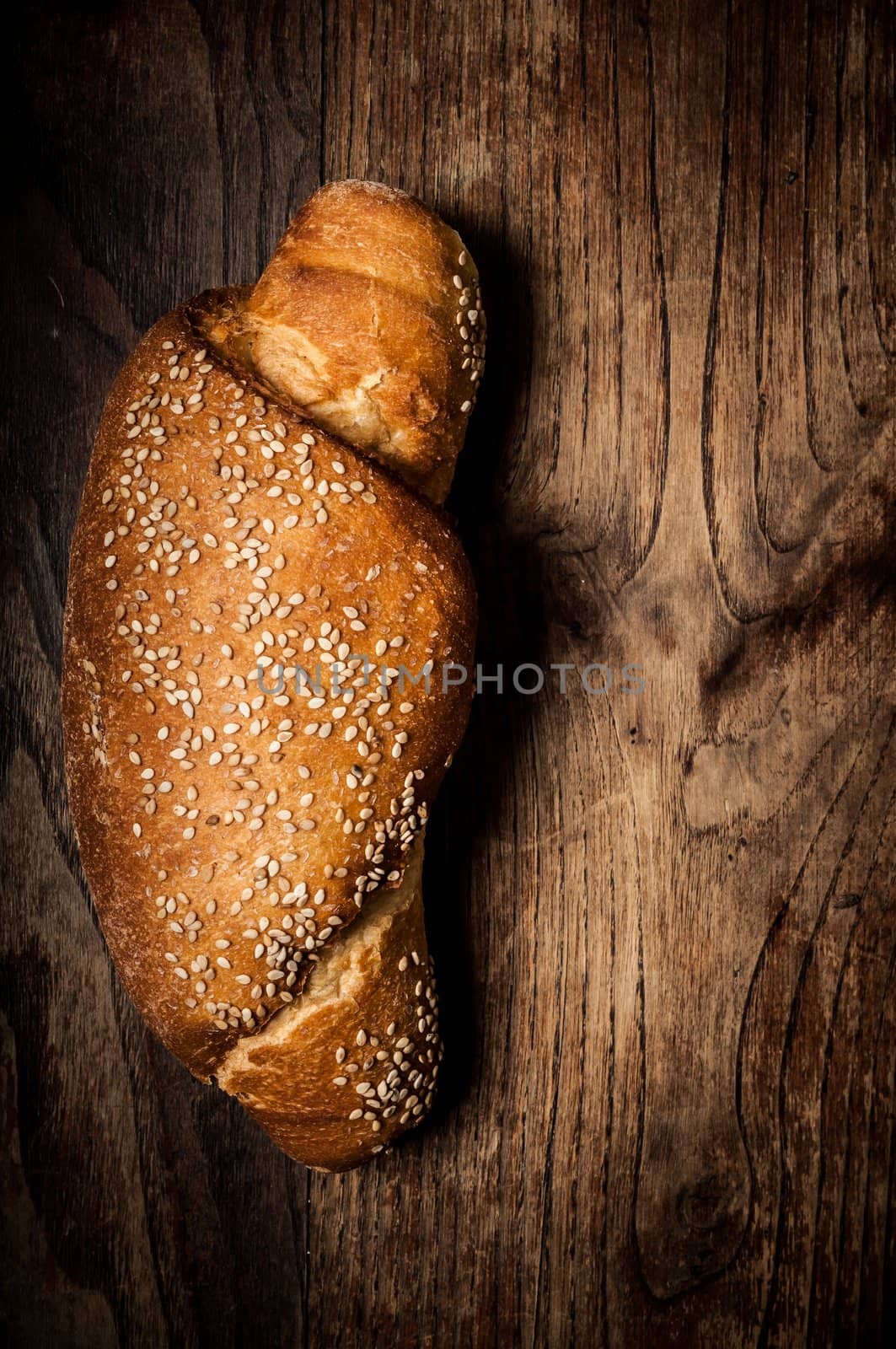 wholemeal sesame bread on brown wood