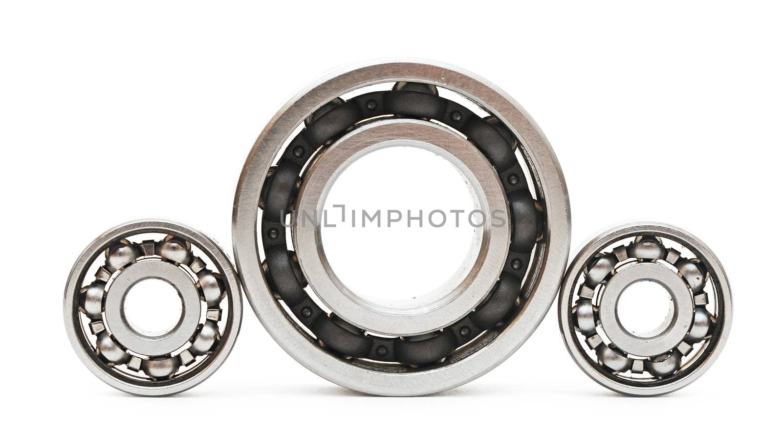 Big and small ball bearings on white background  by inxti
