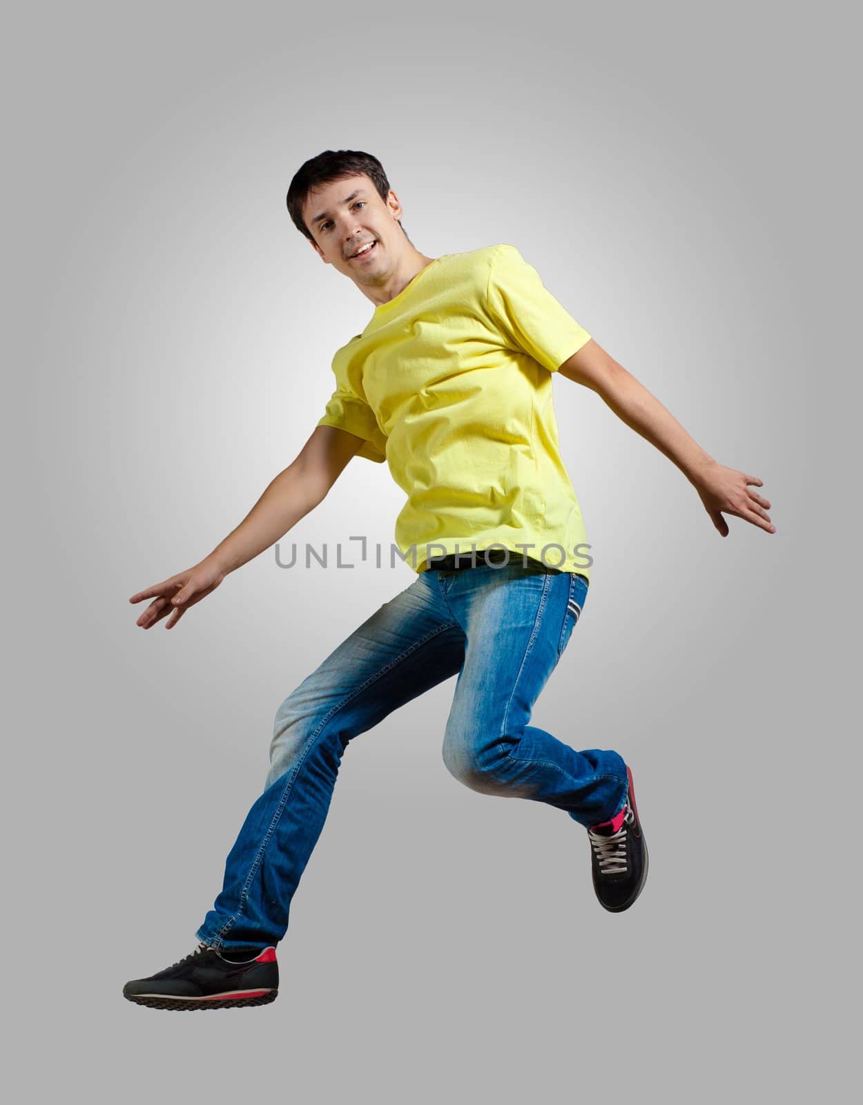 Young man dancing and jumping by sergey_nivens