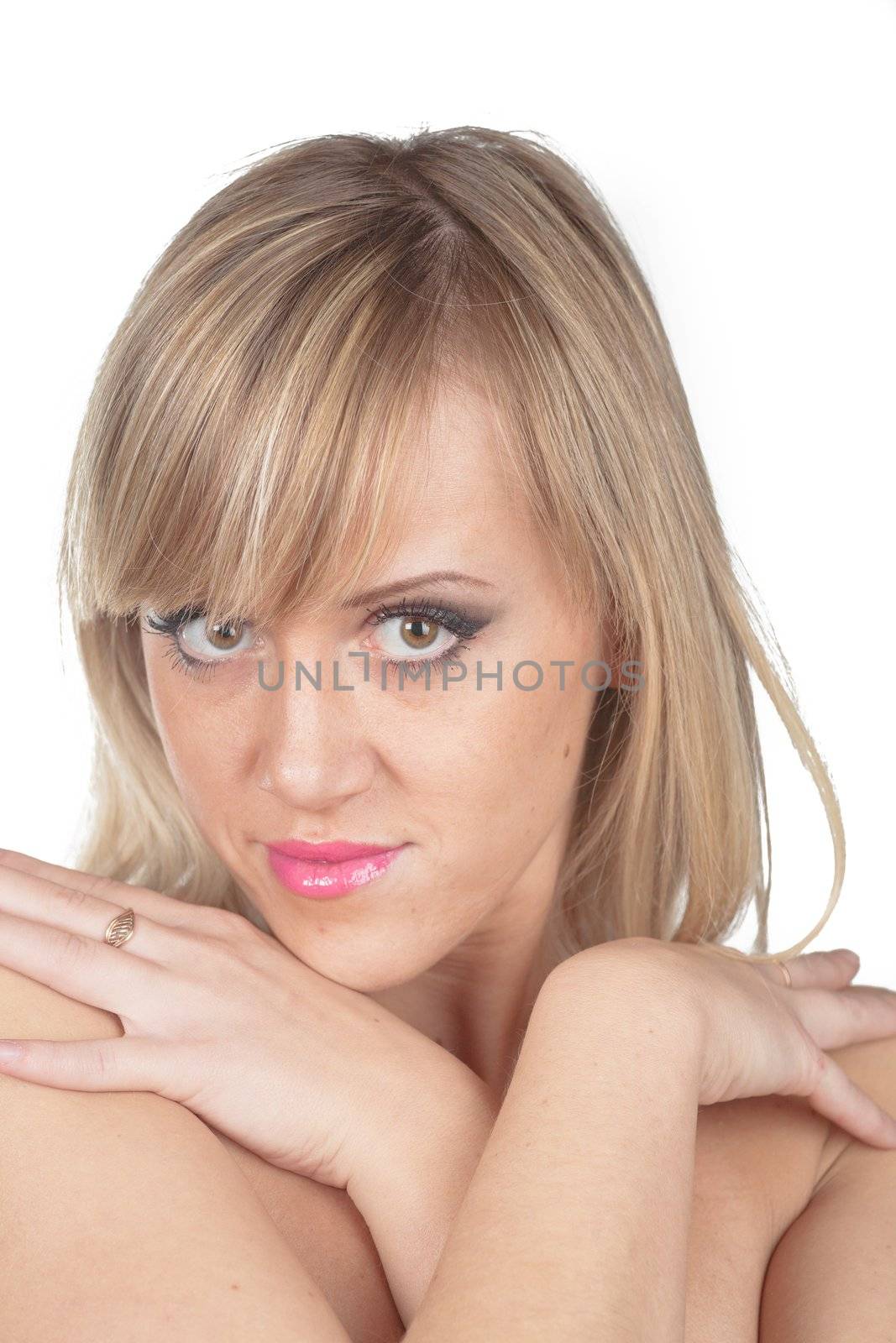 sexy blonde girl hiding her breasts by the hands isolated on white