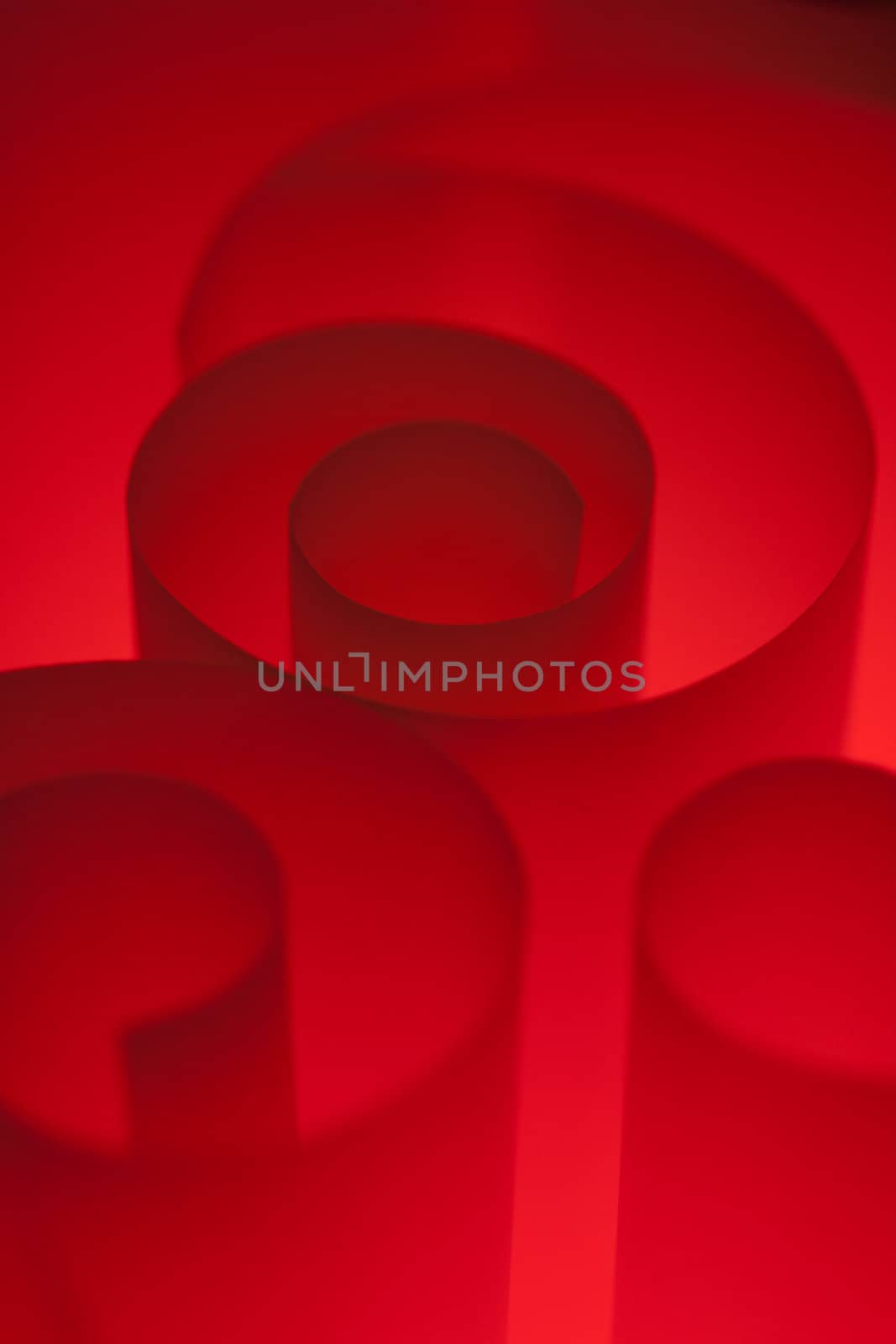 Blank red design paper curled up with soft light