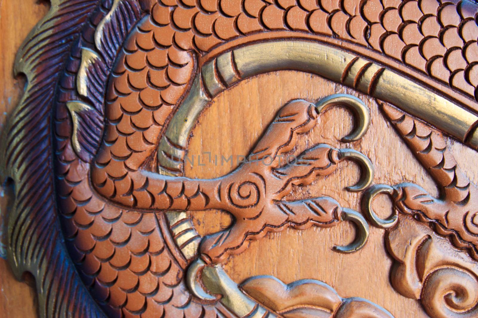 wood carving of a dragon at thailand