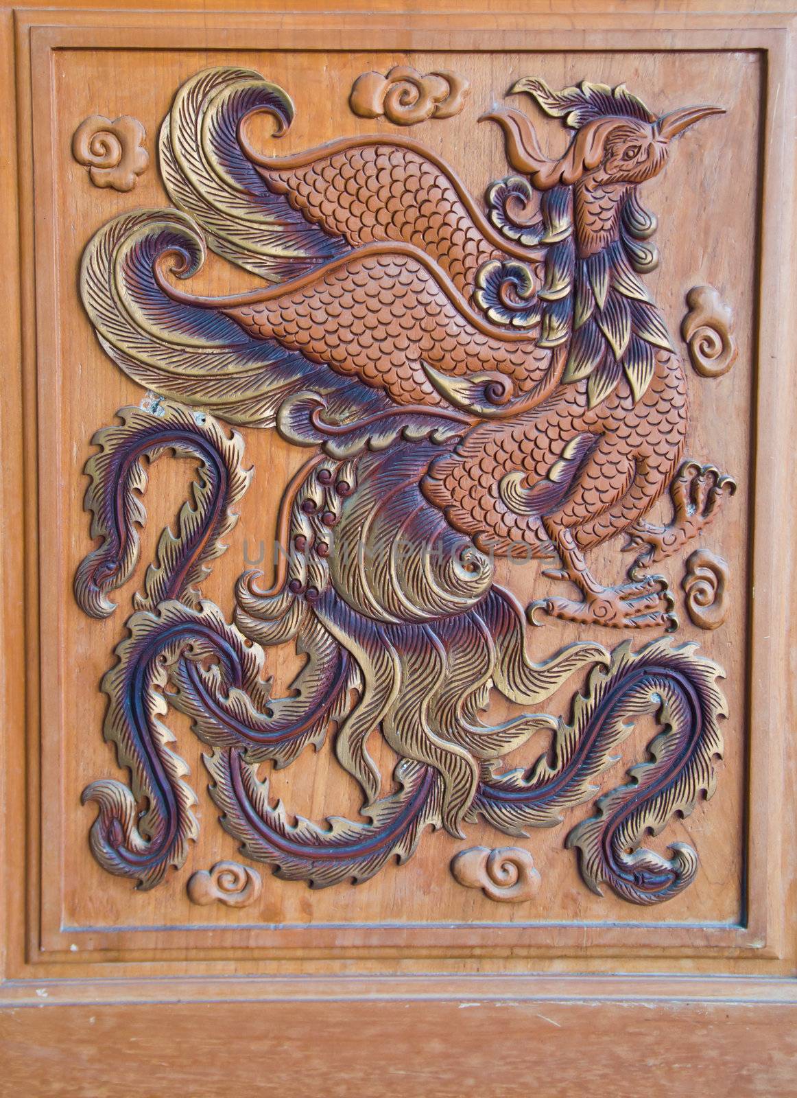 wood carving of a chicken at thailand