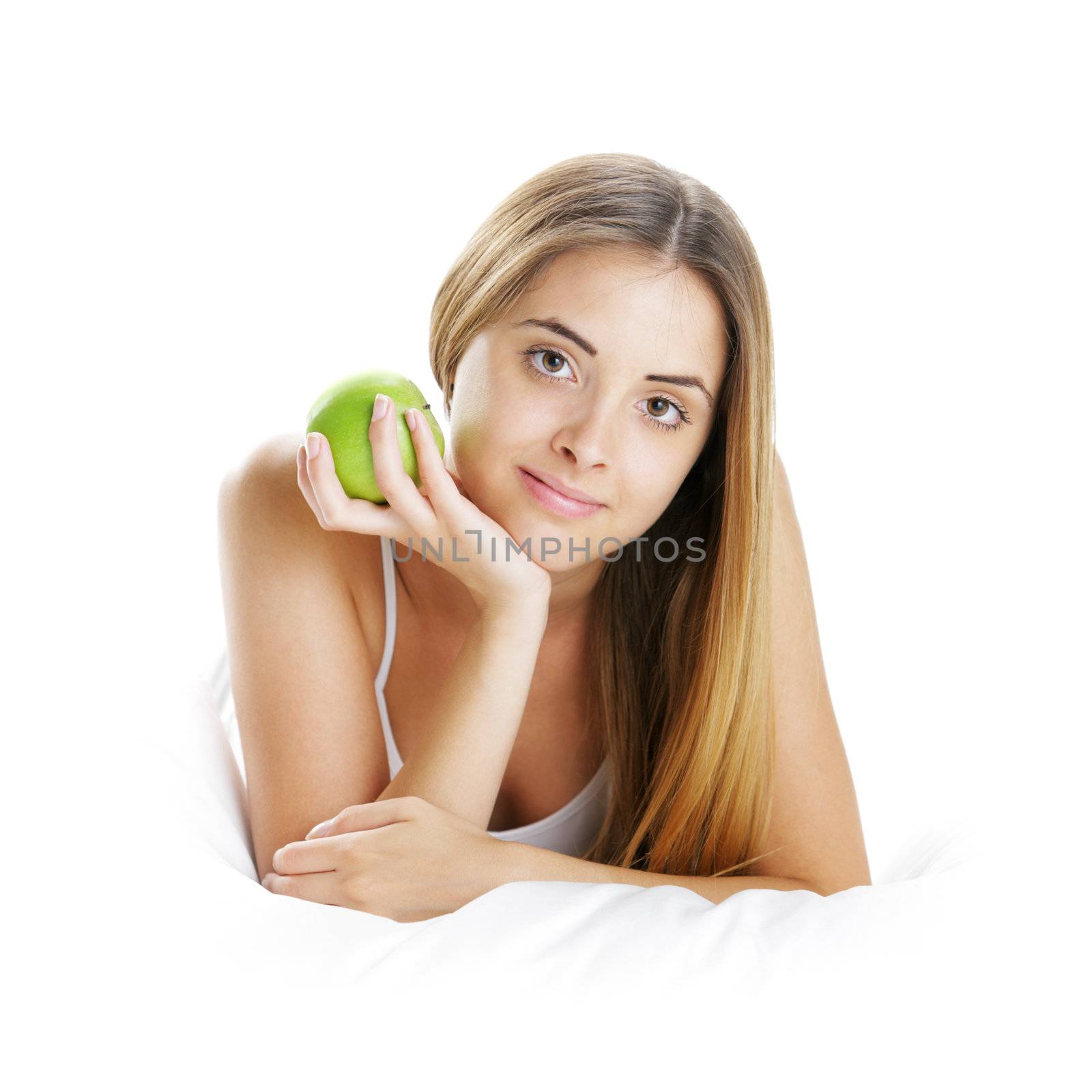 Young Woman Holding Apple in Bed