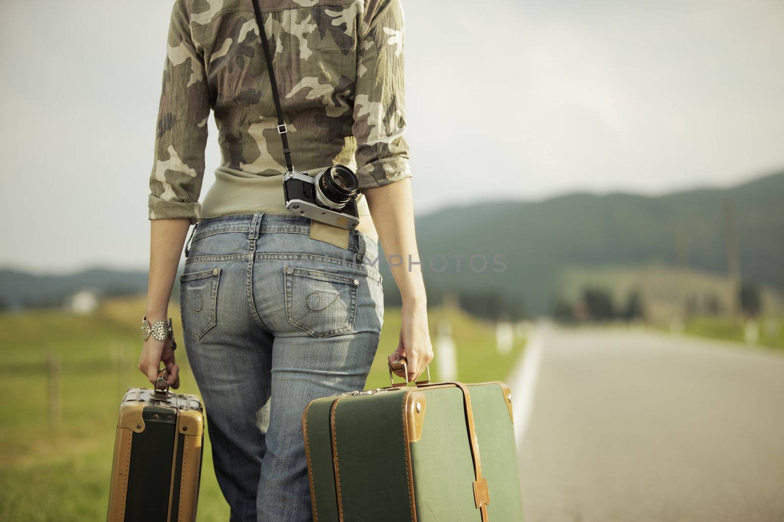 Young woman runaway walks away road. Copy space