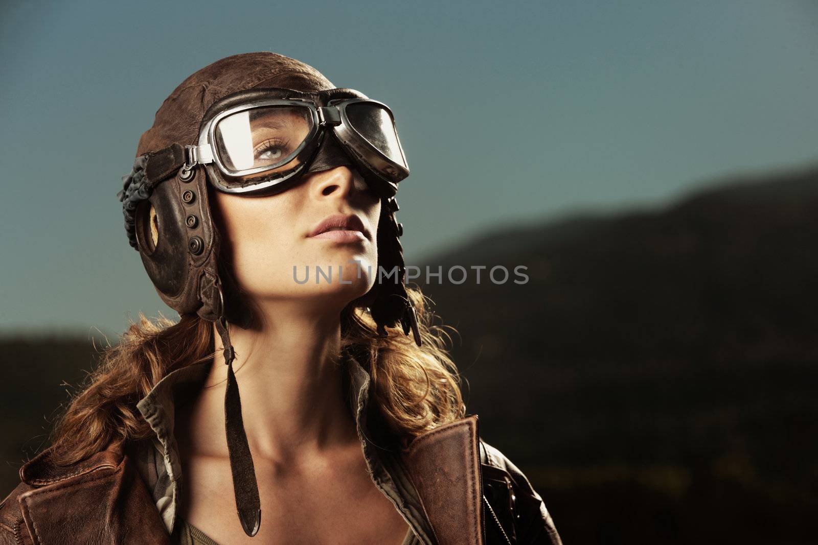 Portrait of young woman airplane pilot