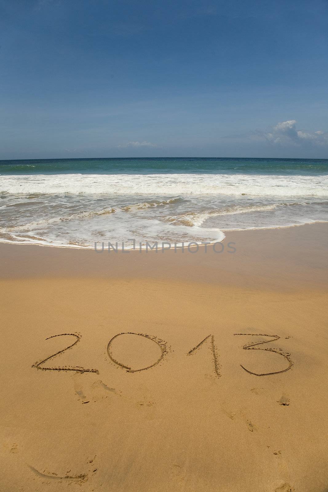 new 2013 year numbers drawings in the sand on the beach