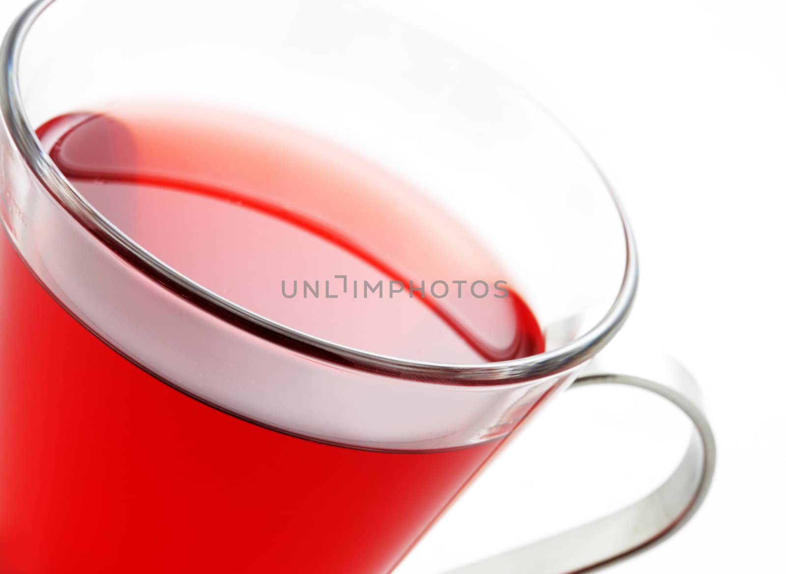 Red tea glass close up, soft focus