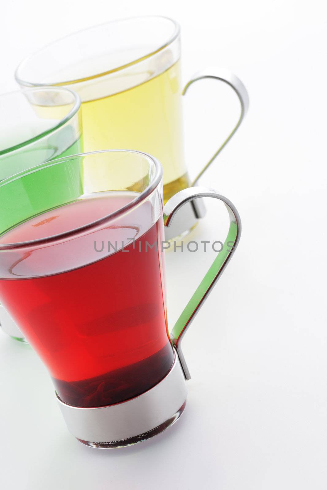 Cups of tea on white background