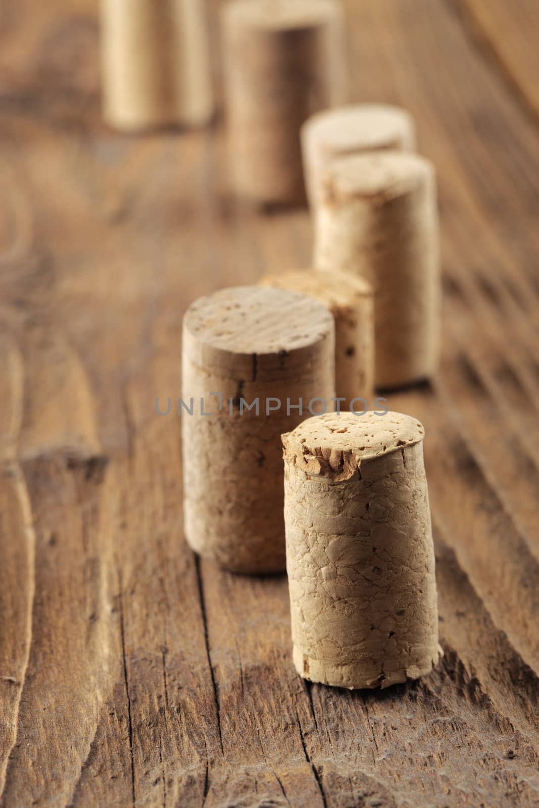 Corks on a wooden table, close up by stokkete