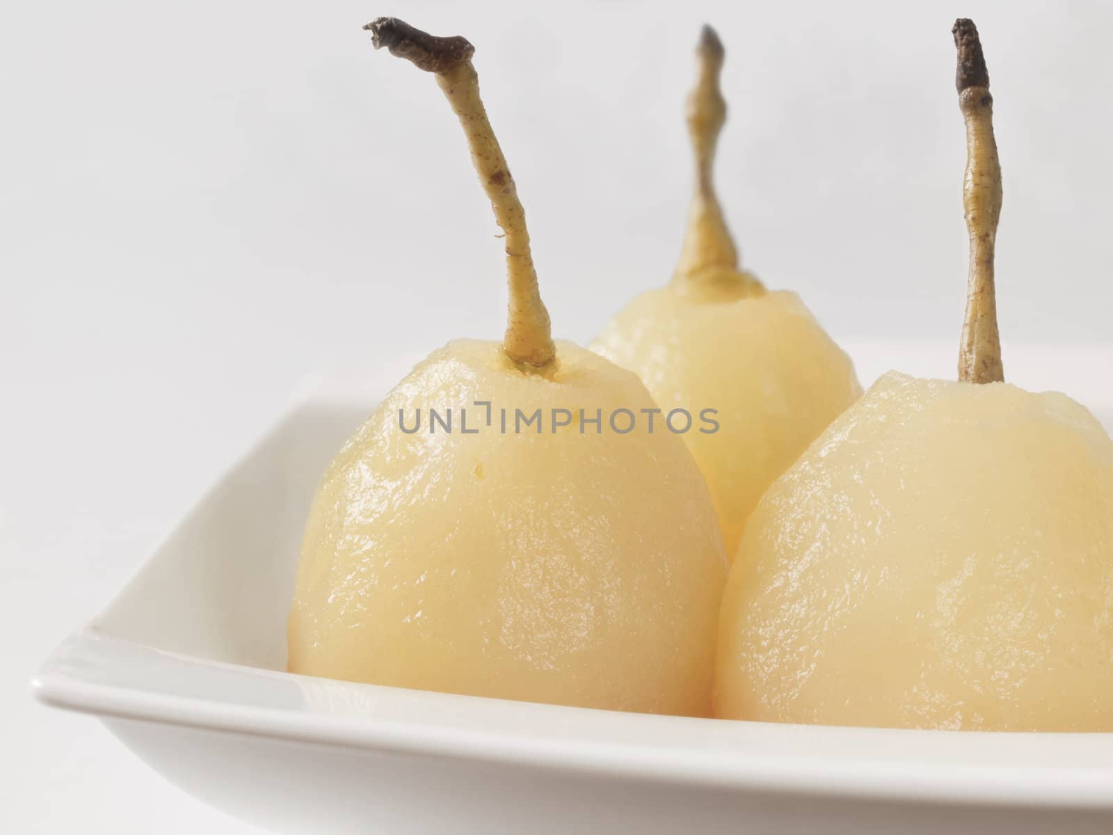 close up of a plate of poached pears