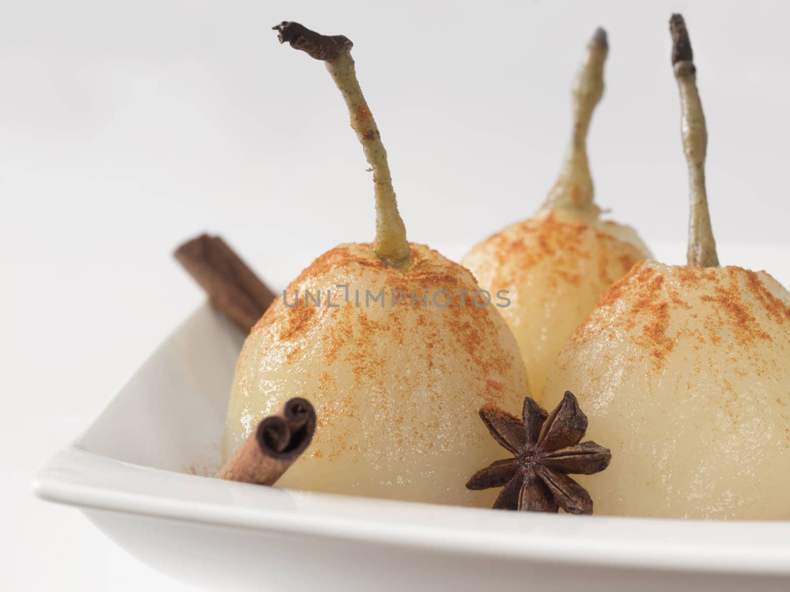 close up of a plate of poached pears