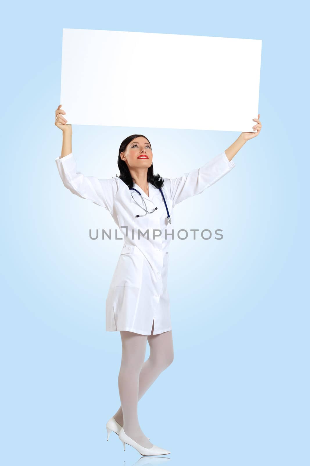 Young female doctor with a banner by sergey_nivens