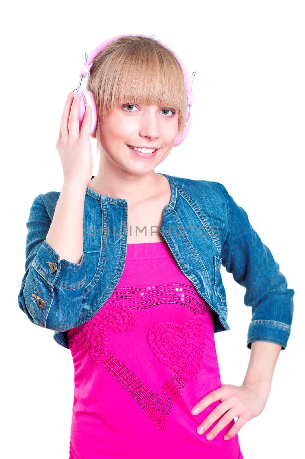 Young attractive woman listing to music with headphones against white background