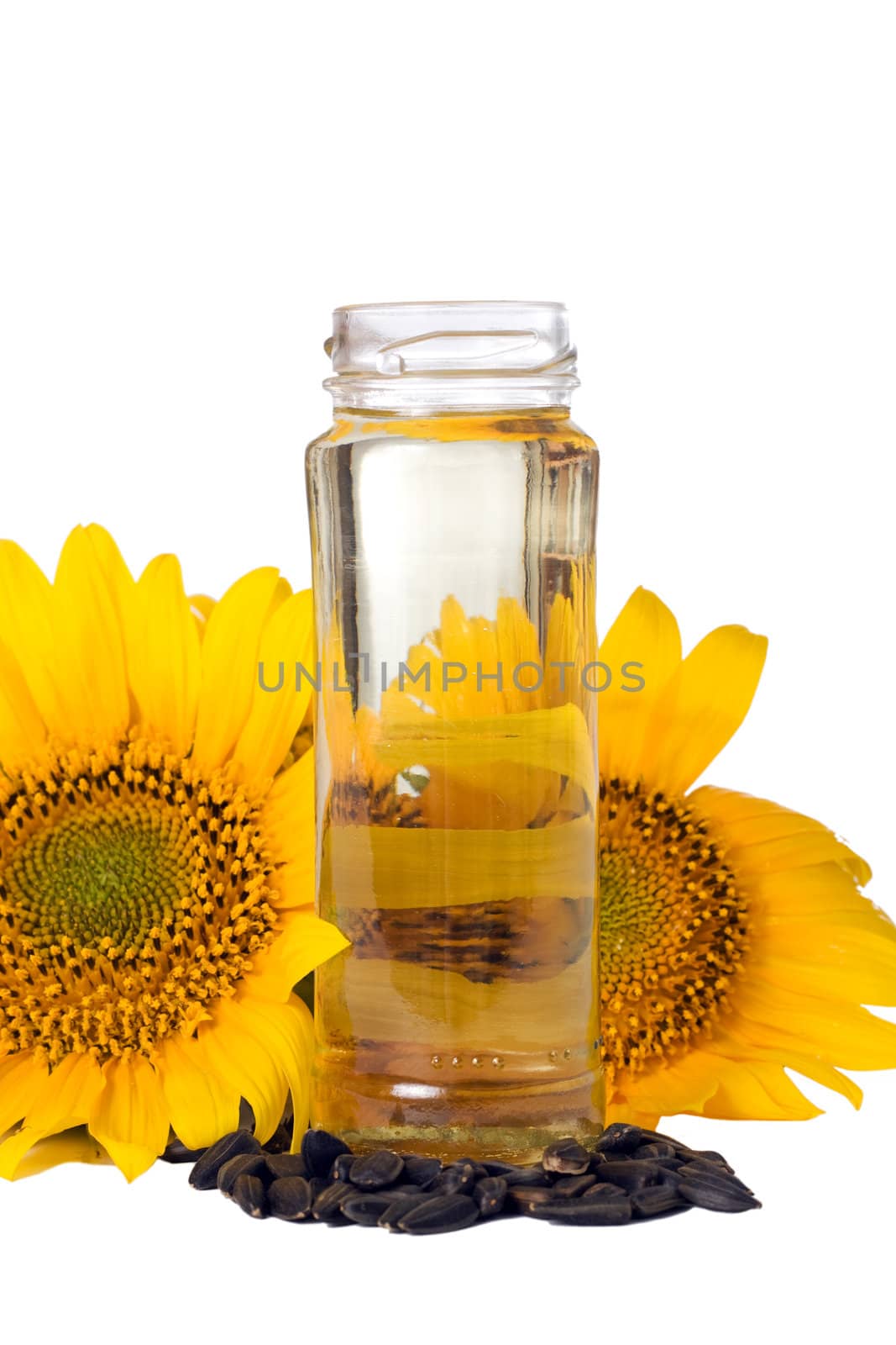 Sunflower seeds and vegetable oil in a bottle isolated