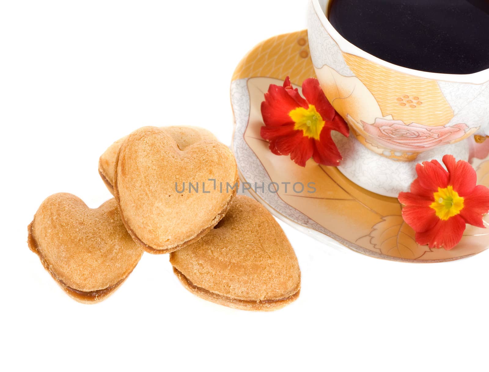 Cup of coffee and heart cookie.
