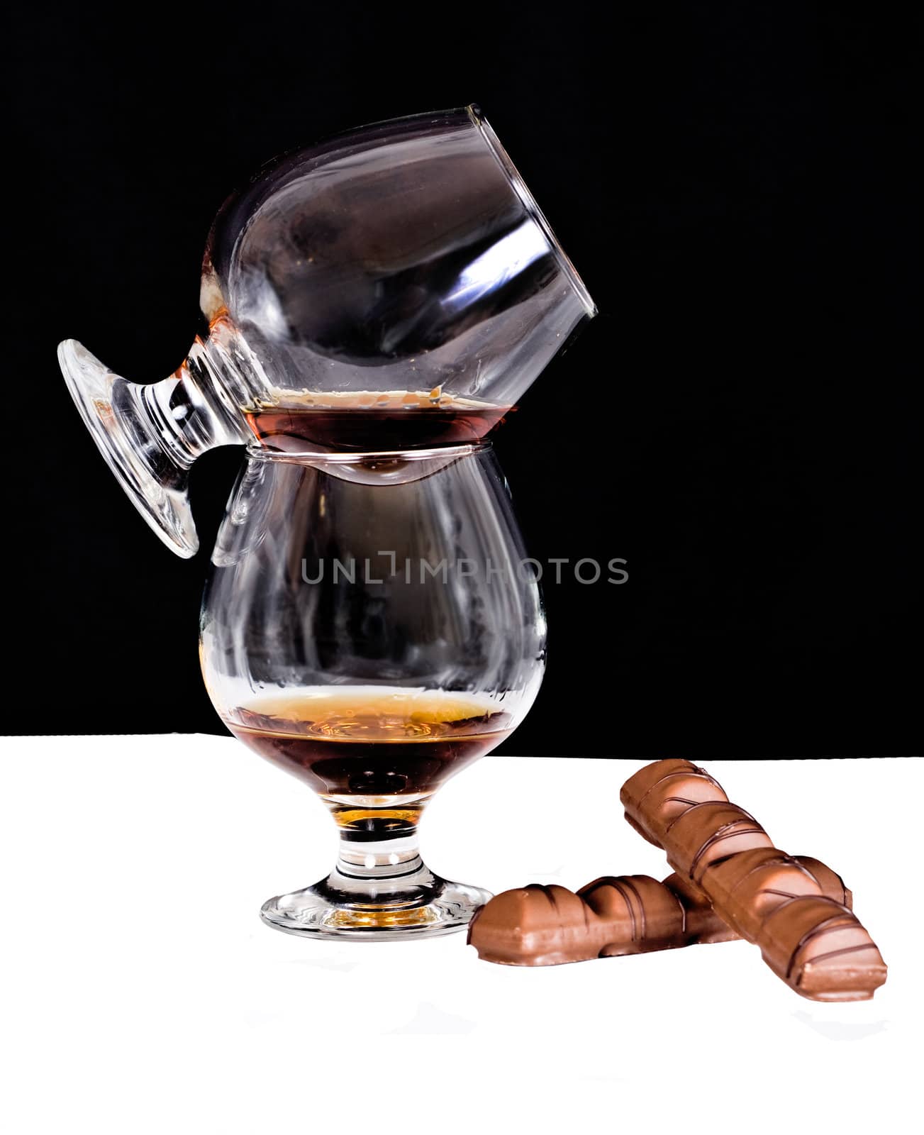 Crystal glass with cognac, chocolate 