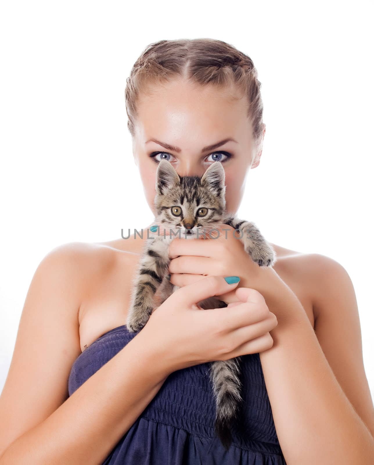 Portrait of a cute girl with a kitten against white background