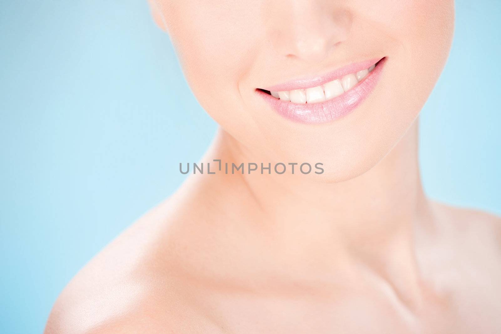 Part of a woman's face, smile
