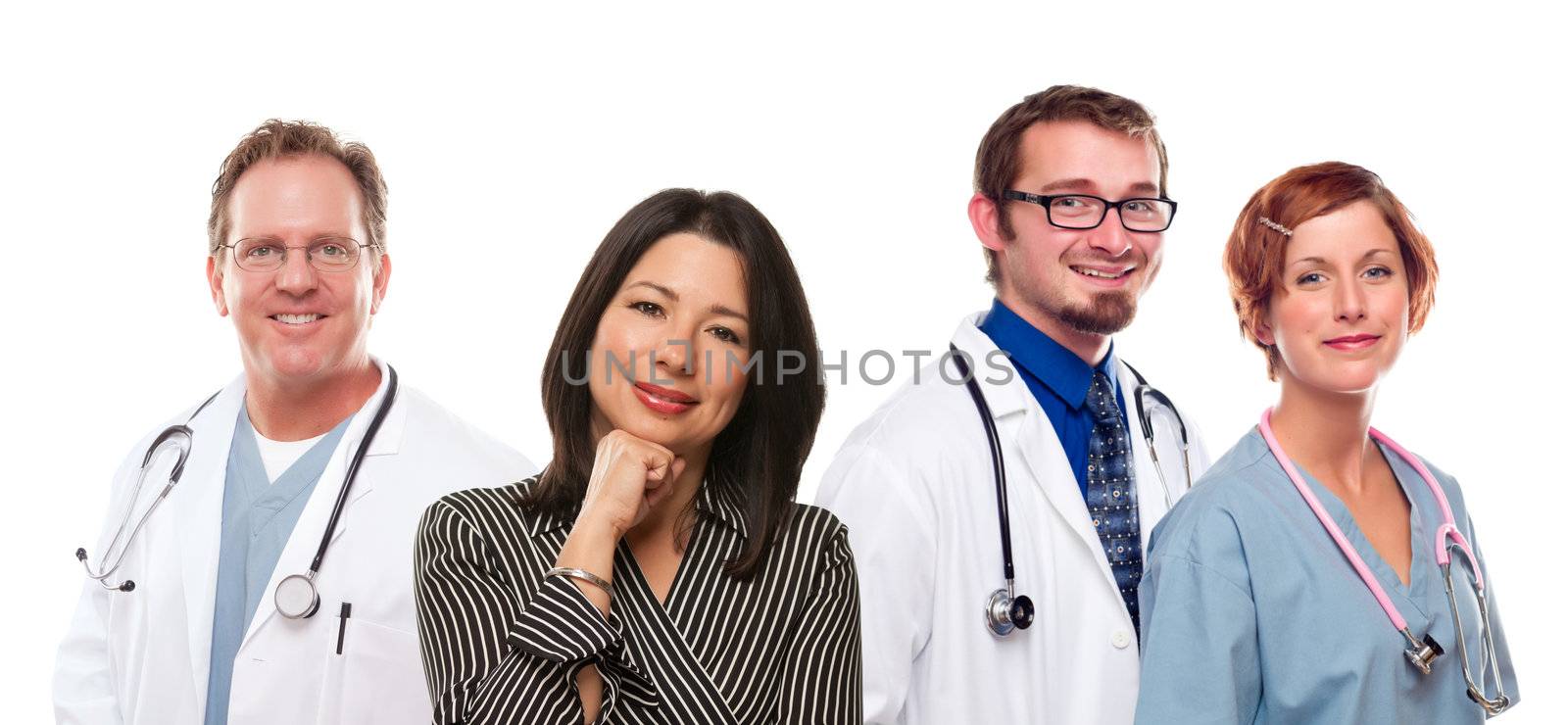 Attractive Hispanic Woman with Male and Female Doctors or Nurses Isolated on a White Background.