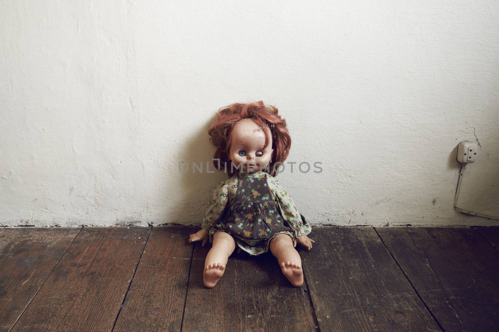 Creepy Vintage Doll on wooden floor