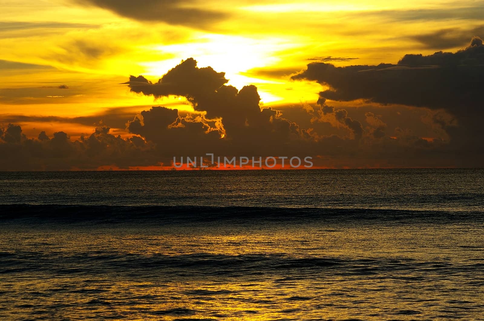 Dramatic sunset sky and ocean by Komar