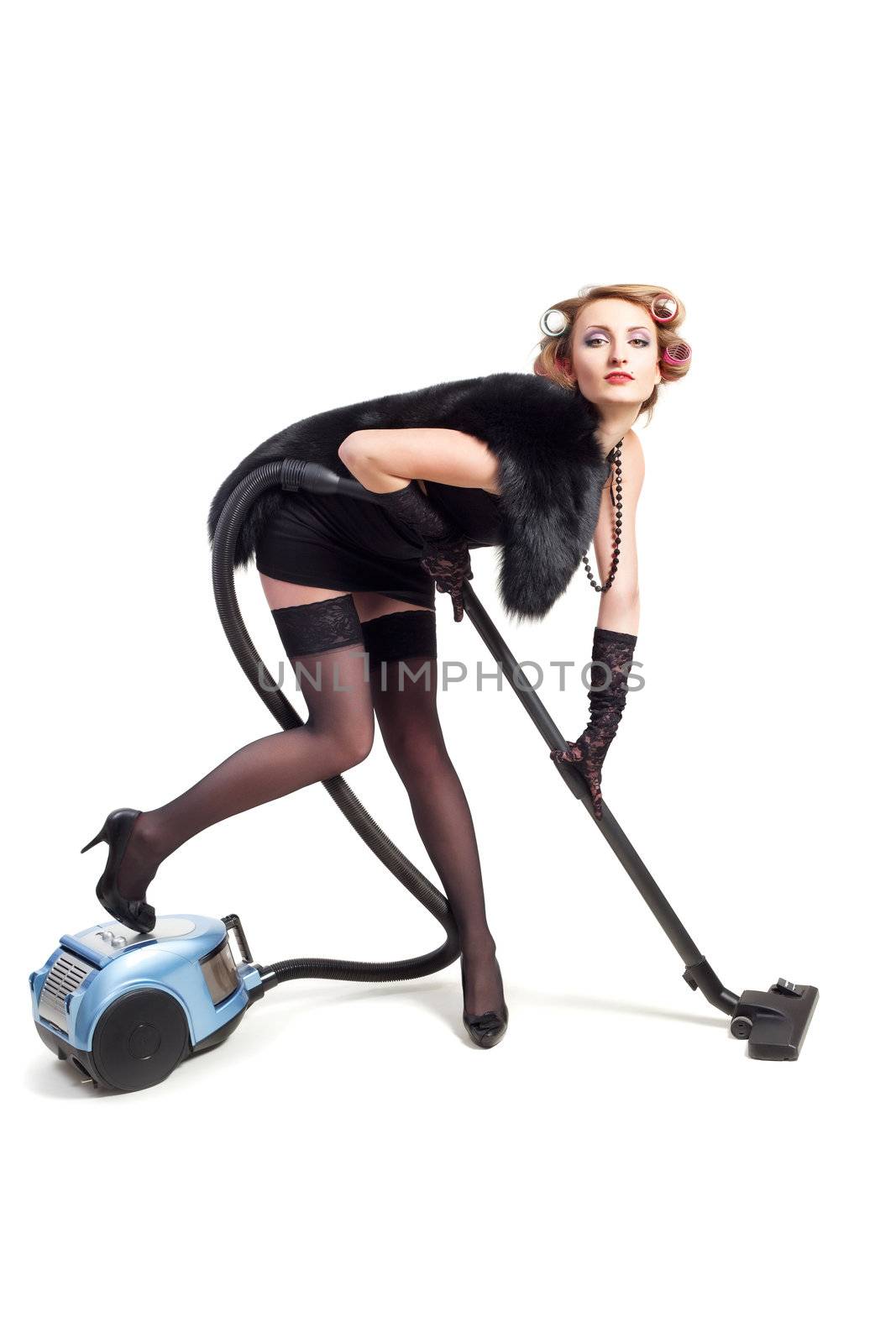 Girl with vacuum cleaner posing for camera