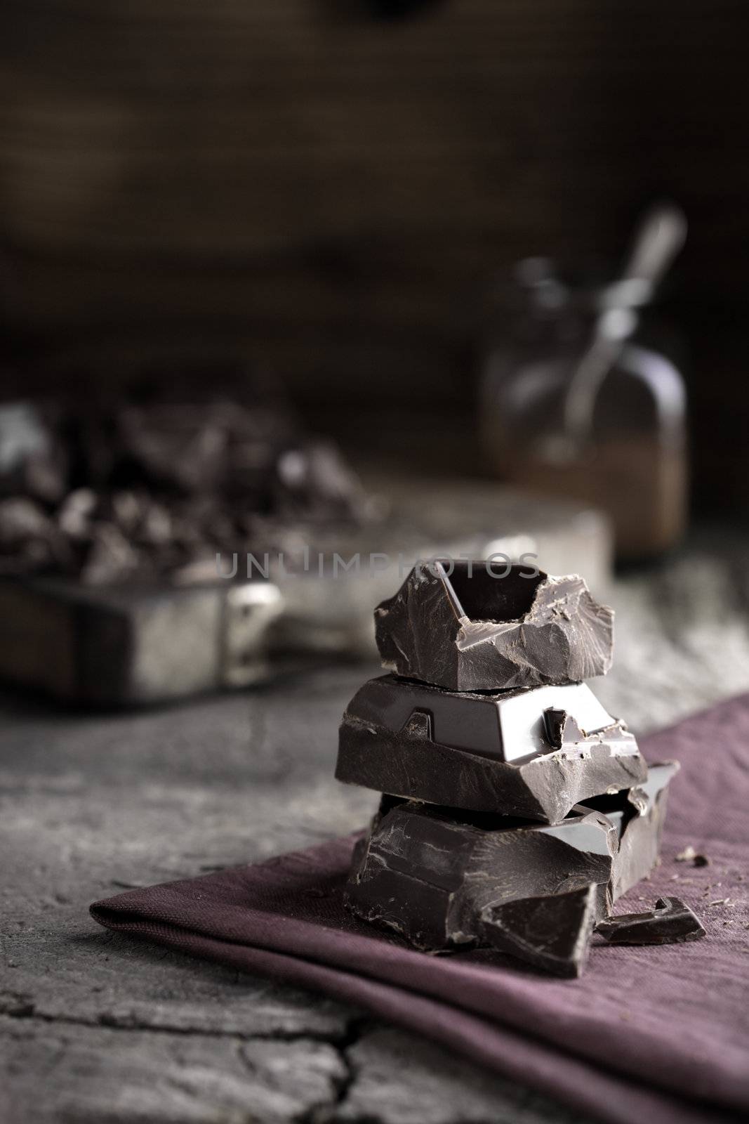 Stack of dark chocolate  by stokkete